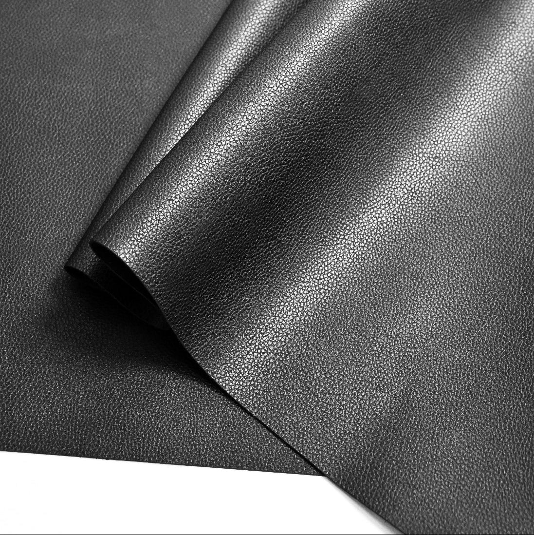 High-quality full-grain black leather texture showcasing the durable and professional-grade materials of the loulex brand.