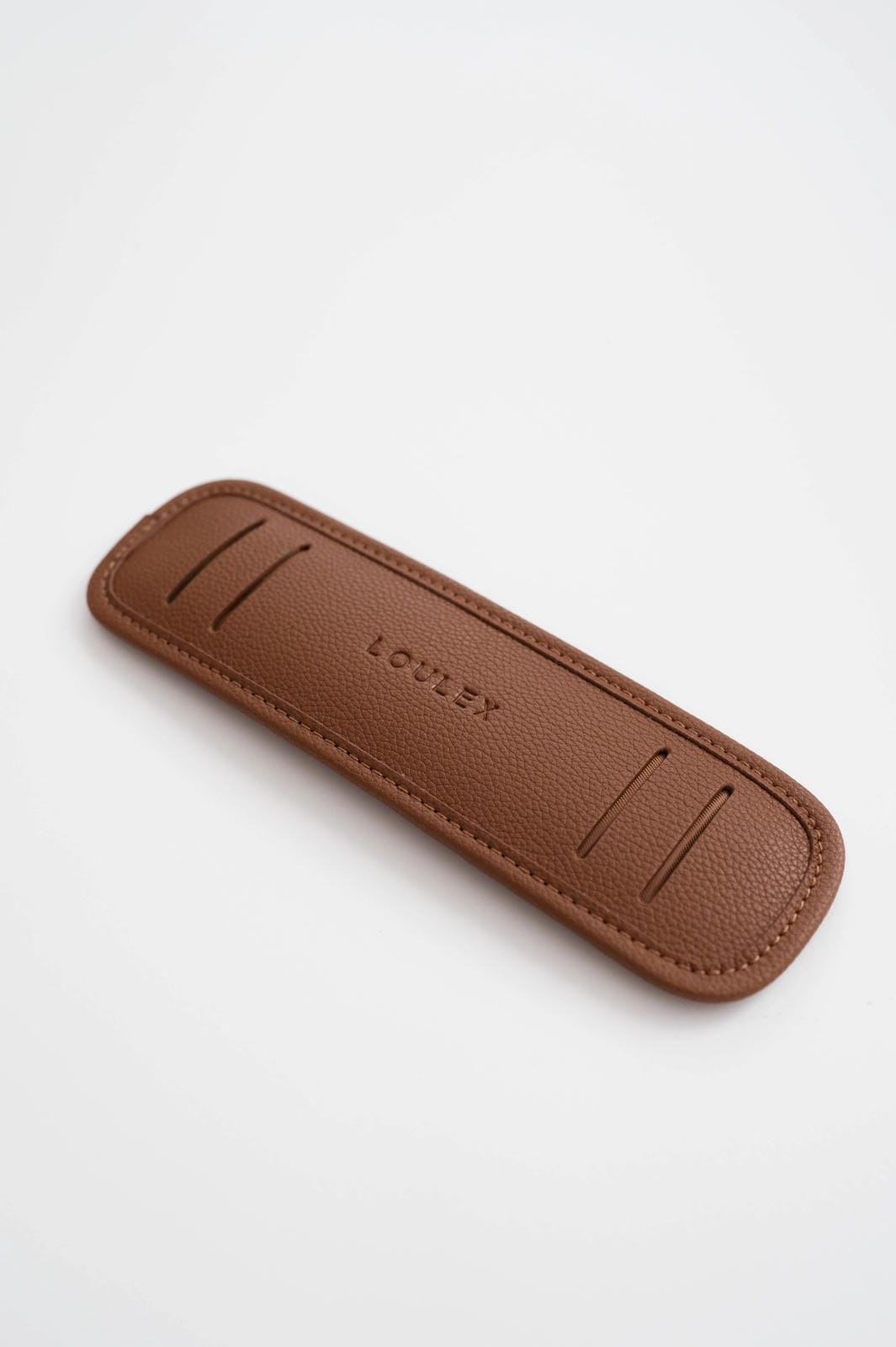 Brown leather case with 'LOULEX' branding on a white background