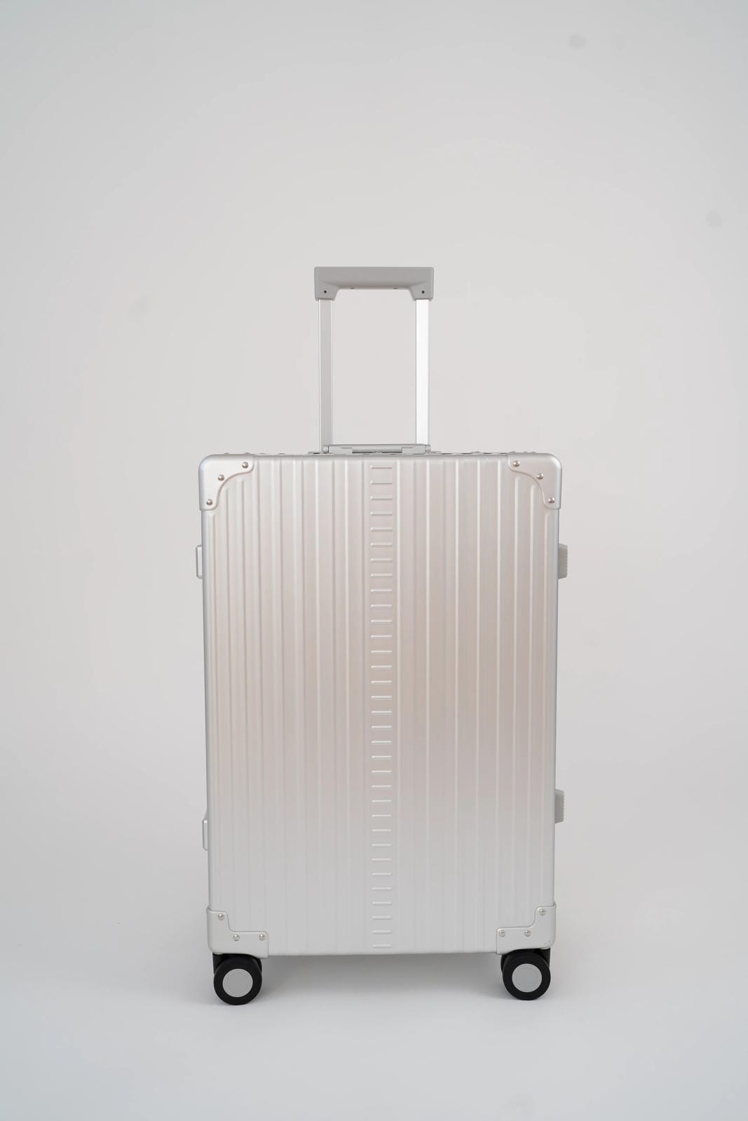 Silver suitcase on a white background