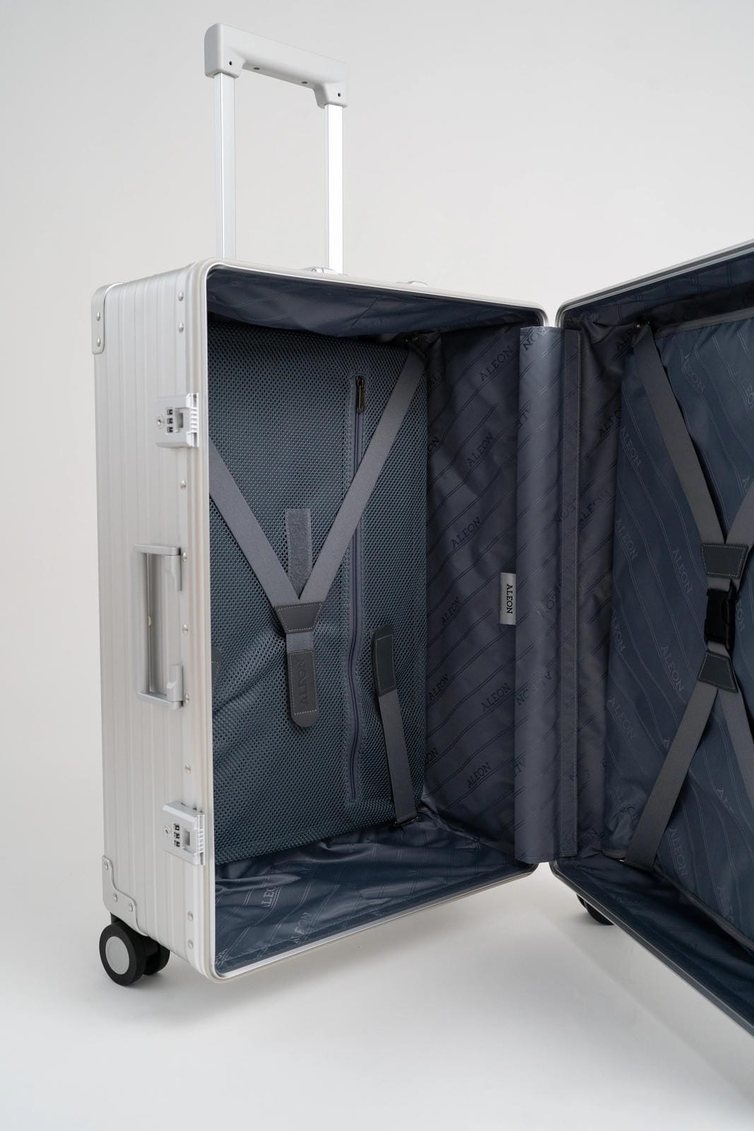 Open suitcase with interior visible on a white background