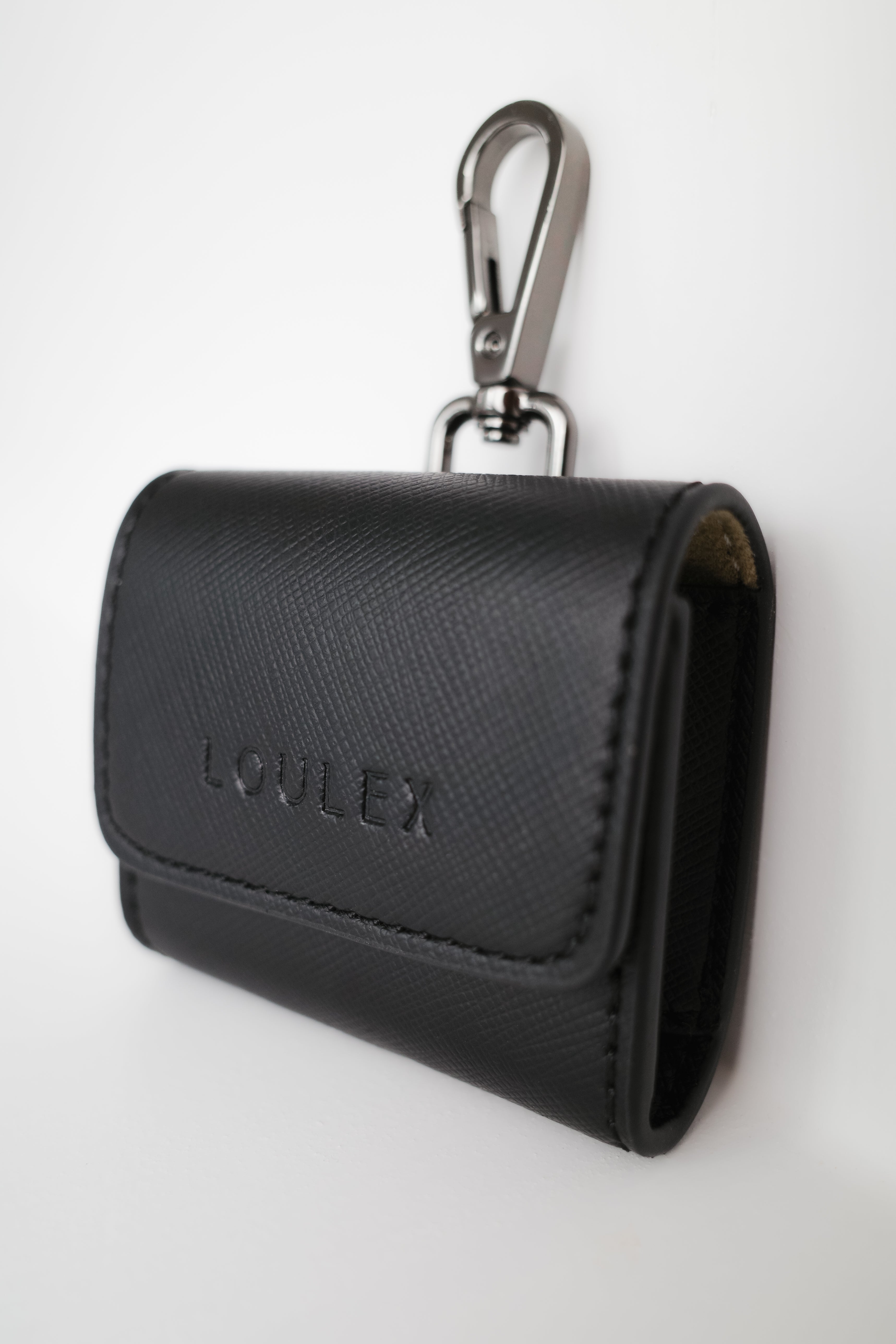 Black key case with carabiner on a white background