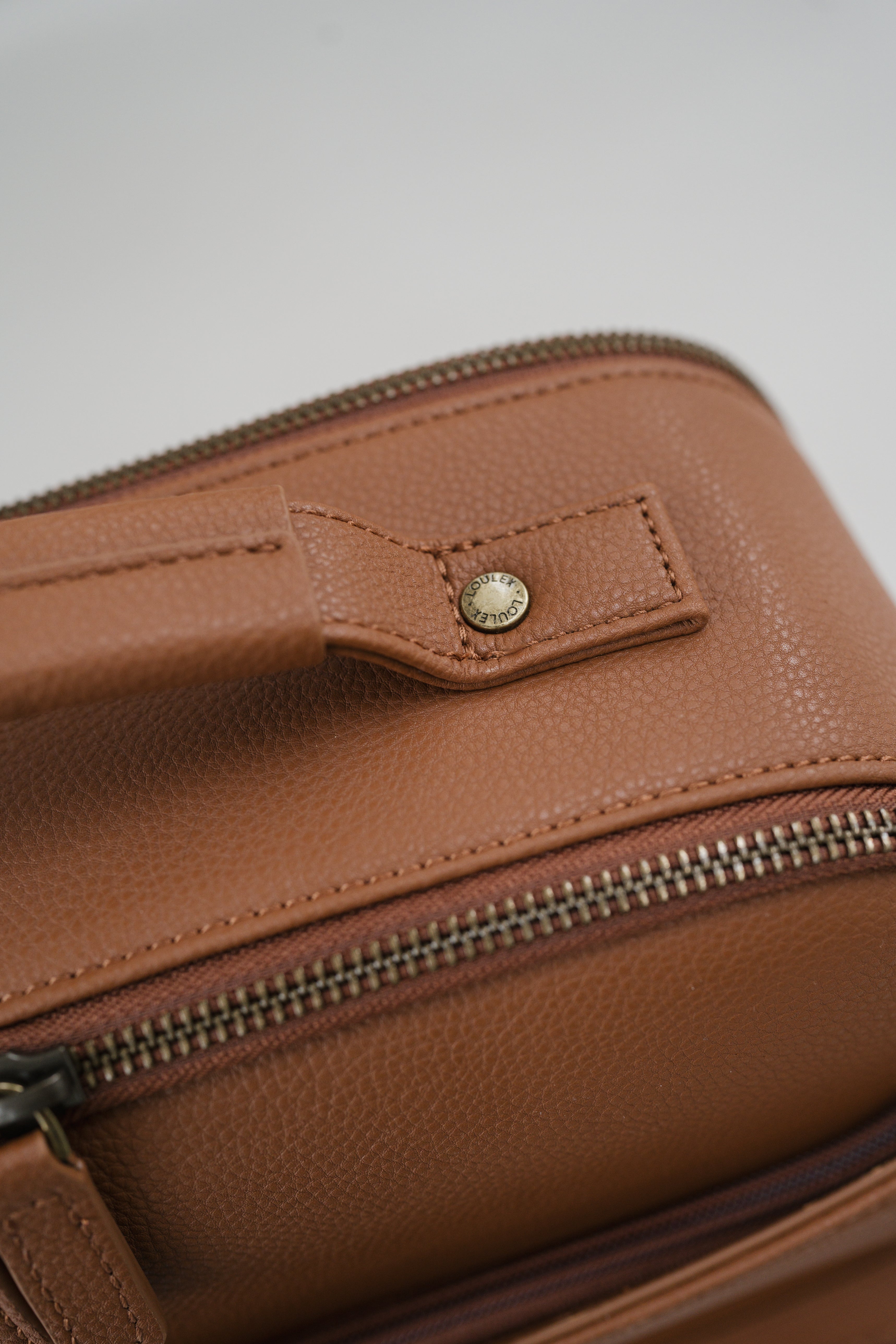 a brown leather backpack