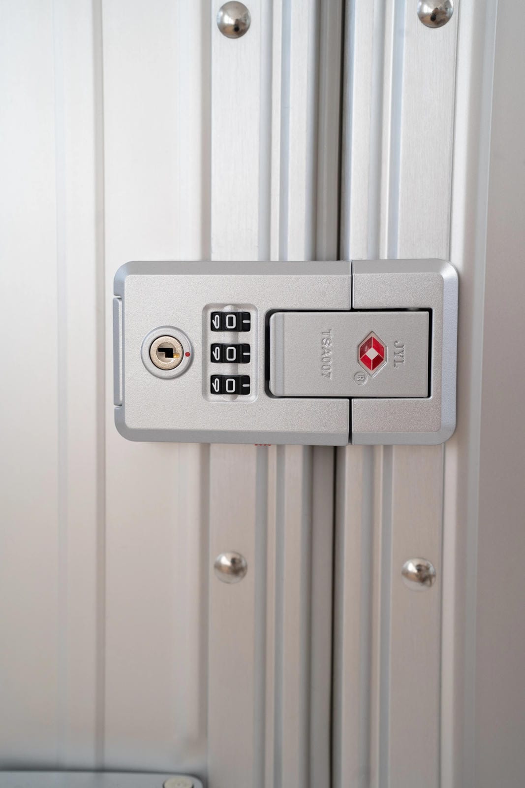 Close-up of a combination lock on a metal surface