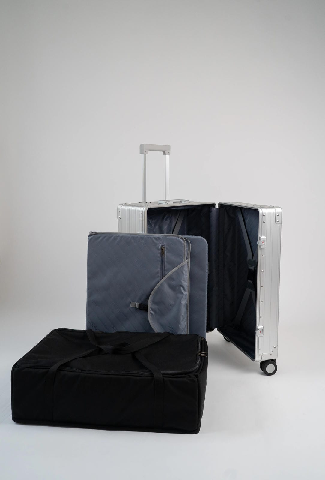 Black and gray luggage set on a light gray background