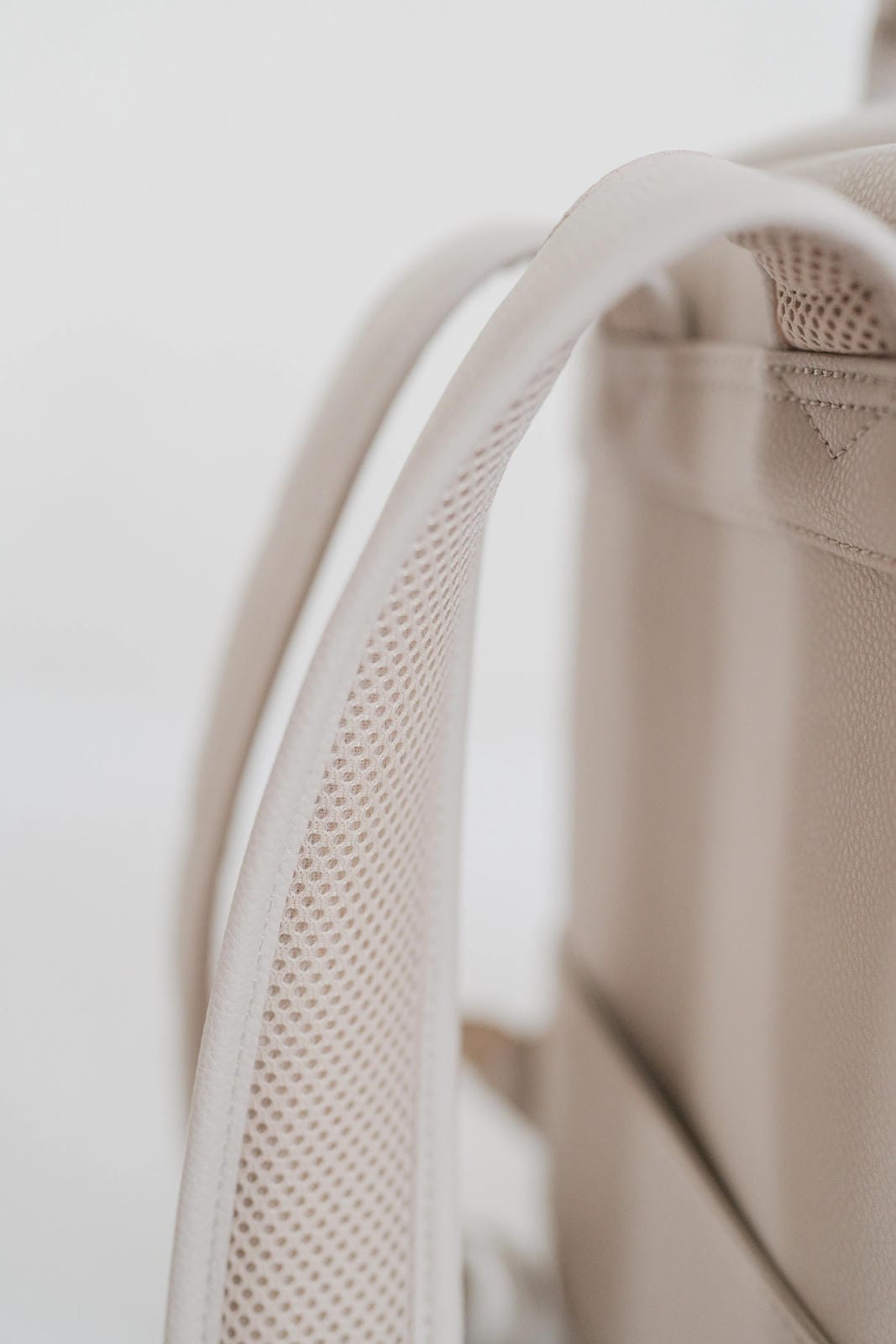 Close-up of a beige mesh bag with a white background