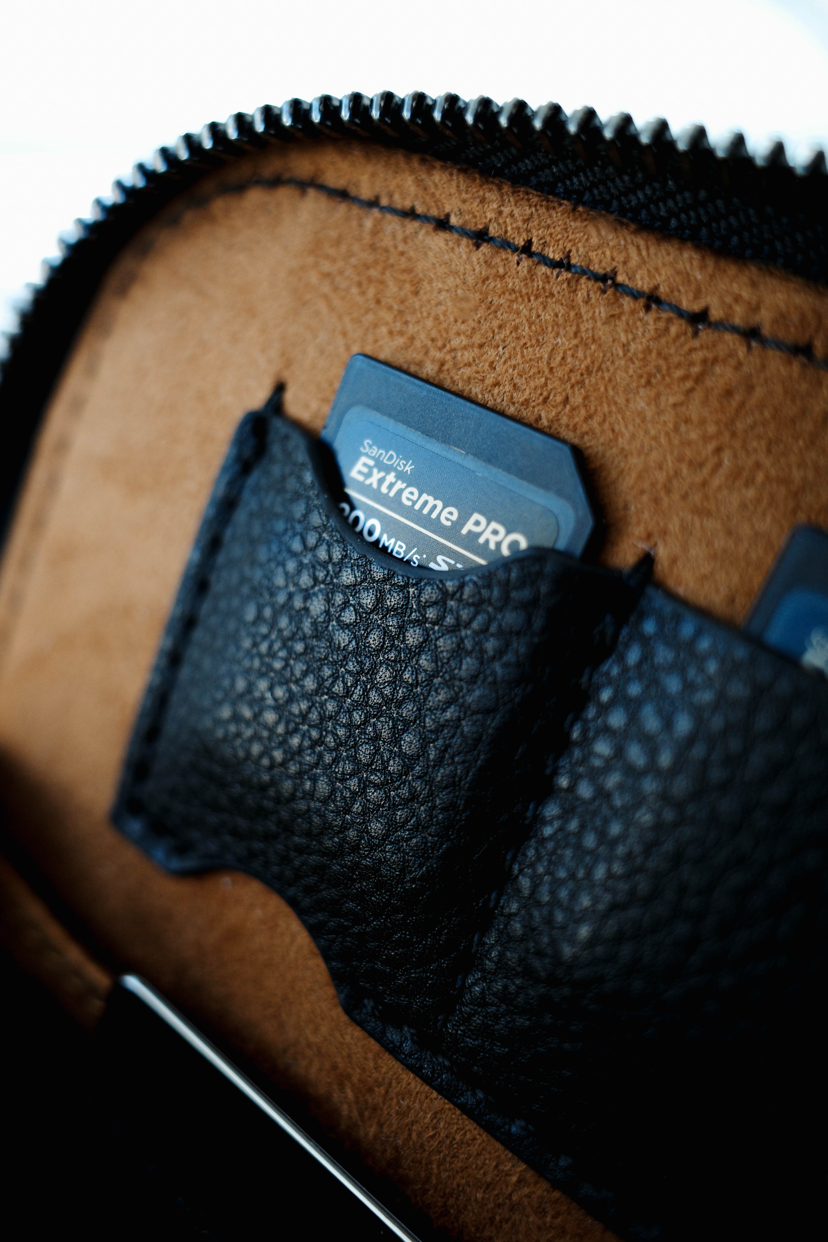 black leather bag with 'LOULEX' 